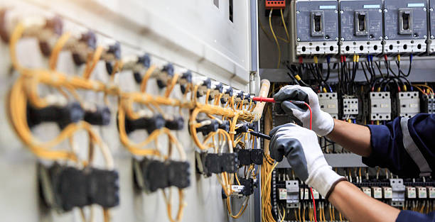 Professional Electrician technician working in Lake Camelot, IL